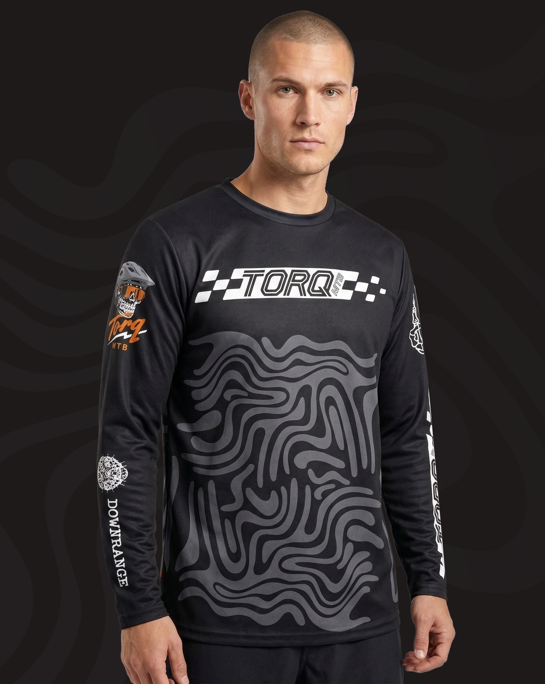 Torq MTB Downrange Jersey worn by a mountain biker, featuring a vibrant design and technical fabric for outdoor cycling comfort.